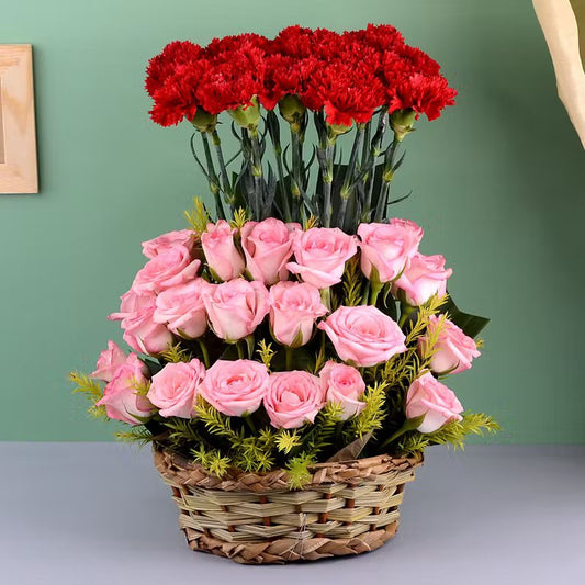 22 Pink Roses And 14 Red Carnation In A Round Basket